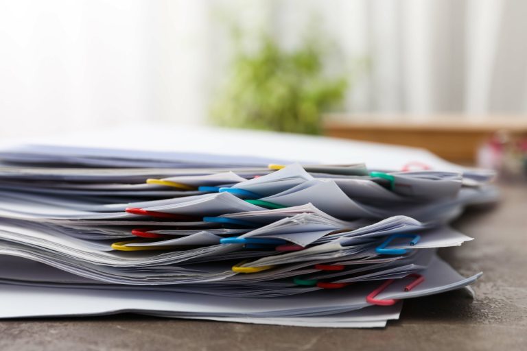 Concept of different office accessories - paper with clip